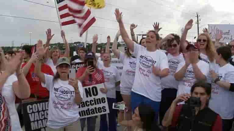 A handful of Houston Methodist workers assembled on Monday night at the hospital's Baytown campus to criticize the hospital's requirements that all rank-and-file staffs take the COVID-19 vaccination by June 7 to maintain their employment. Anti-vaccine supporters from the neighborhood accompanied the unvaccinated workers, holding posters opposing Houston Methodist's vaccine mandate and COVID-19 vaccinations in particular. Jennifer Bridges, a Baytown nurse, coordinated a "walkout" of non-compliant Houston Methodist staff for 7:45 p.m. Monday, nearly an hour after her last job. Bridges, who has spearheaded a small but dedicated group of Houston Methodist employees who have refused to cooperate with the hospital's vaccine requirement, informed the Houston Press that those preparations had been thwarted earlier that day. “They sent emails, and then I got a call from their head of security stating that we weren’t allowed to be on the property doing this,” Bridges said. As a result, a crowd of roughly 70 people gathered in the center of Baker Road, near the Baytown hospital, on the driveways. “They can’t control us out here,” Bridges said. “I’m tired of being controlled and I’m tired of people trying to tell me what to do.” Pierre Charland, a Houston Methodist Medical Center nurse, went back to Baytown to rally with his colleagues against the vaccination mandate. Charland, who also supported the case against Houston Methodist, expressed his dissatisfaction with the hospital's requirement for the vaccinations before they could be completely approved by FDA. “I knew that if there was a hospital that would do it, it would be Methodist early on,” Charland said. “They like to give vaccines. I’ve worked other places, and they don’t worry so much about employee health.” Workers will be terminated if not vaccinated Personnel was instructed that if they didn't get at least one vaccination dose by midnight Monday, they'd be placed on two-week unsupervised probation, after which they'd be terminated, according to Charland. “I mean, I wouldn’t risk losing my job for not getting the flu shot. But this one is different,” Charland claimed. Smith assured that not a single worker will be terminated "No Houston Methodist employees walked off the job this evening," Smith confirmed afterward on Monday evening. "All employees seen leaving this evening were just leaving after their normal shift," she said. Bridges were taken aback by how upset she felt at the end of her last shift on Monday. She remarked, "As I was leaving, I started crying." “And I took off my mask, got my shirt on, and just walked out, said, ‘I'm done.'” Maria Mosqueda and Udeen Greene, both in their scrubs and wearing surgical masks, stood across the street on Houston Methodist grounds Monday evening, watching the throng of demonstrators. Mosqueda and Greene, both registered nurses who assist at the Baytown hospital, got the chance to somehow get immunized as quickly as the vaccines became accessible to Houston Methodist staff this year. They explained that they don't comprehend why the professionals with whom they've served do not believe in the evidence that proves immunizations are effective in treating. “They have the right to get vaccinated or not, but Methodist, they have the right to take care of, first, the patients,” Mosqueda said.